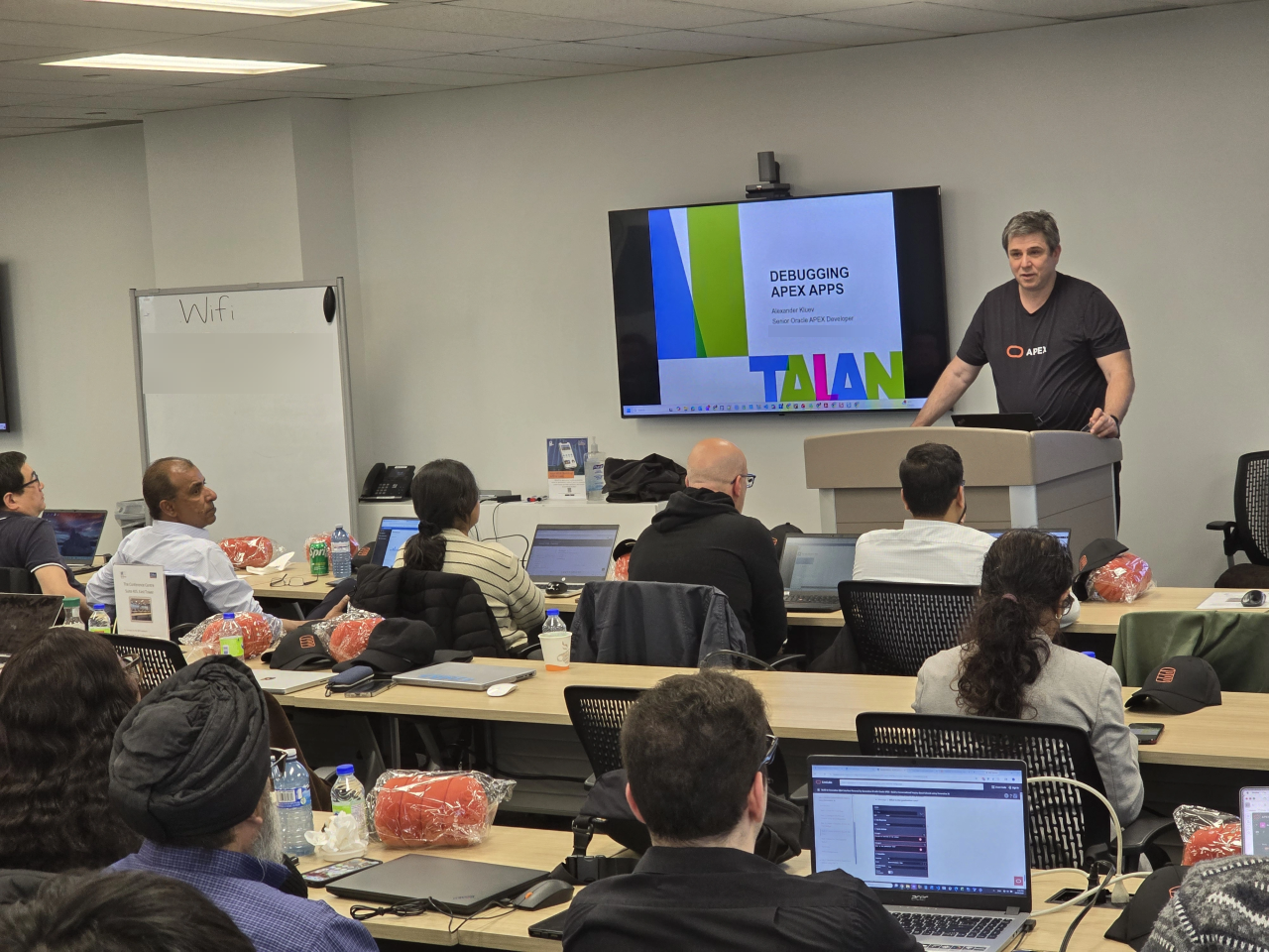 Alexander Kluev presenting Debugging APEX Apps to attendees in Toronto